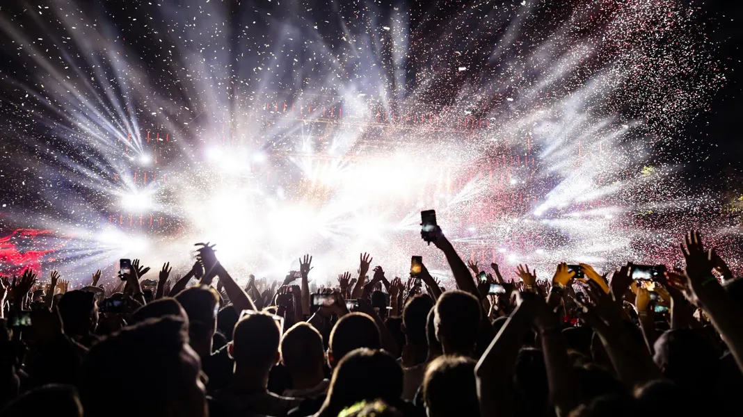 Concert crowd under stage lights