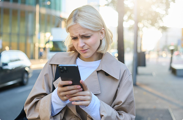 Traveler checking ride prices on phone
